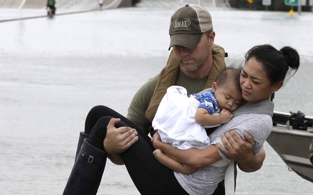 Photo Of Mother And Baby’s Rescue Becomes Symbol Of Storm