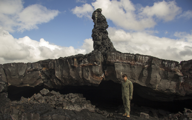 USGS / HAWAIIAN VOLCANO OBSERVATORY                                  A fascinating cross section of a hornito was revealed recently, when a partial collapse provided a window into a portion of an abandoned lava tube. The void space behind the geologist was filled with lava at some point, with lava and gas forced through the narrow crack in the center of the photograph. This ejected bits of spatter, which solidified around the opening and built a tall hornito.