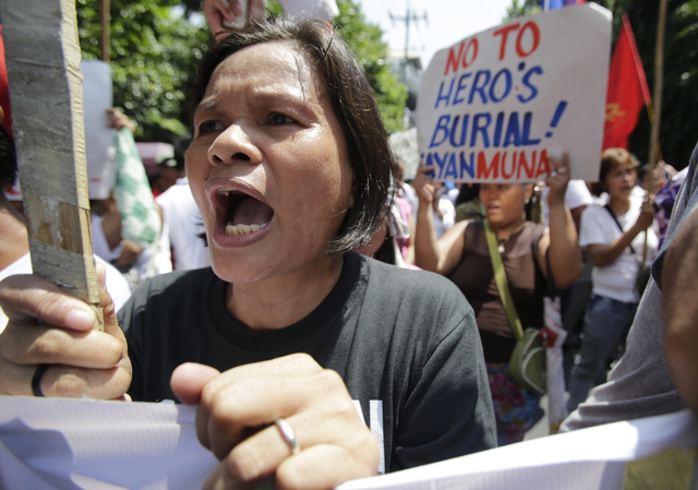 Philippine government defends decision on hero burial for Marcos ...