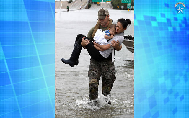 Photo of mother and baby’s rescue becomes symbol of storm