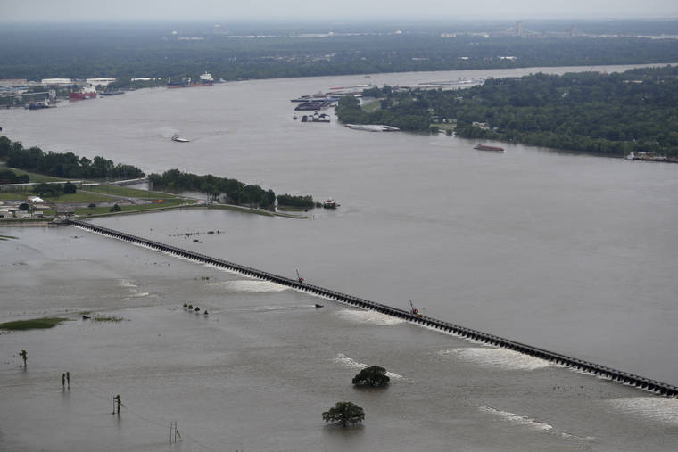 ASSOCIATED PRESS / MAY 10
                                Workers open bays of the Bonnet Carre Spillway, to divert rising water from the Mississippi River to Lake Pontchartrain, upriver from New Orleans, in Norco, La. It will be months before state officials know whether losses from floods and spillway openings qualify Louisiana as a fisheries disaster. Department of Wildlife and Fisheries officials say floods began around November 2018, and a full 12 months’ data is needed to compare to averages for the previous 5 years. The governors of Louisiana, Mississippi and Alabama asked months ago for US Commerce Secretary Wilbur Ross to declare a fisheries disaster, making federal grants available to affected people.