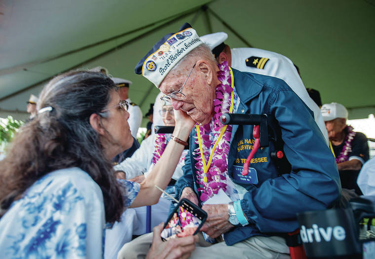 DENNIS ODA / DODA@STARADVERTISER.COM
                                Lisa Barnes checks on her husband, Thomas Berg, 97, before the start of the ceremony on Saturday. Berg is a Pearl Harbor survivor who was a crewmember of the USS Tennessee.