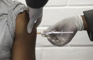 SIPHIWE SIBEKO/POOL VIA AP / JUNE 24
                                A volunteer receives an injection at the Chris Hani Baragwanath hospital in Soweto, Johannesburg, as part of Africa’s first participation in a COVID-19 vaccine trial developed at the University of Oxford in Britain in conjunction with the pharmaceutical company AstraZeneca. AstraZeneca Inc. announced that the Food and Drug Administration is letting it resume testing of its COVID-19 vaccine candidate in the U.S.