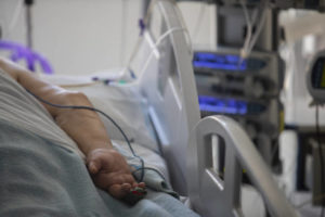 ASSOCIATED PRESS / OCT. 6 A patient with COVID-19 lies in a bed at one of the intensive care units (ICU) at the University Hospital of Torrejon in Torrejon de Ardoz, Spain. Now public health officials are warning that a much broader segment of the population also may be at risk: Even moderately excess weight may increase the odds of severe disease.