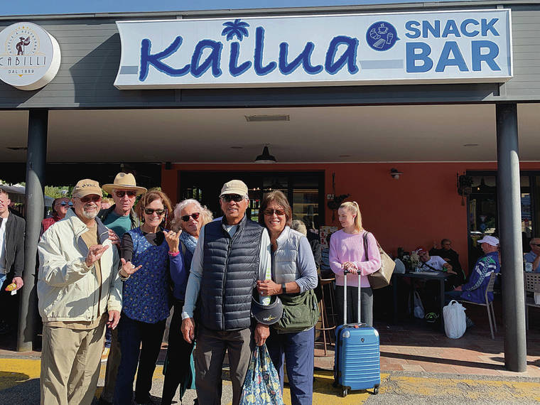 Jim Duca, from left, John Wilson, Anne Marie Duca, Adele Wilson, Glenn Yee and Kaylene Yee discovered the Kailua Snack Bar in Castelvecchio, Italy, in October 2019. Anne Marie Duca wrote that the owner had fallen in love with windsurfing in Kailua when visiting Hawaii, and it made his customers happy to see the pictures of Oahu’s beautiful beaches. Photo by Mara DeCassan.