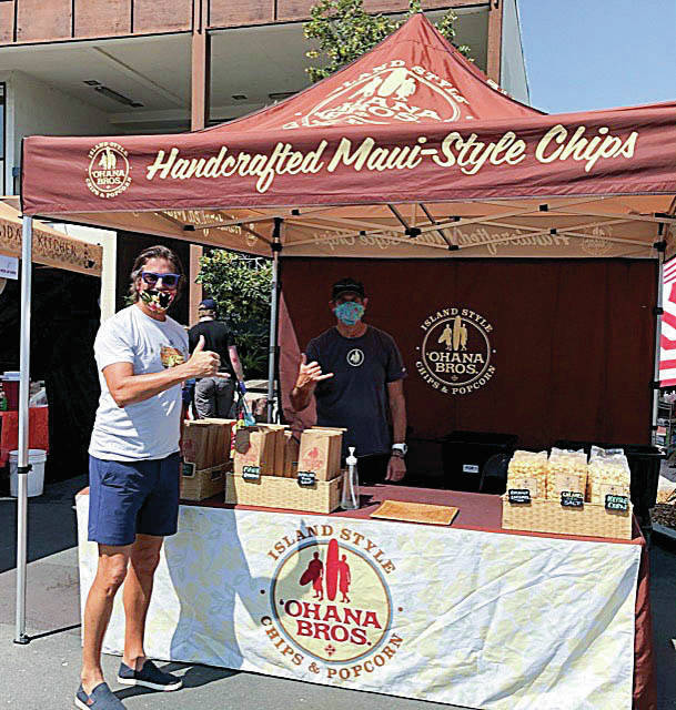 While visiting family in California in August, Makakilo resident 
Drew Stathis spotted Ohana Bros. Snack Co. at the farmers market 
in Palo Alto. Also pictured is Michael from Ohana Bros. 
                                Photo by Julienne Stathis.