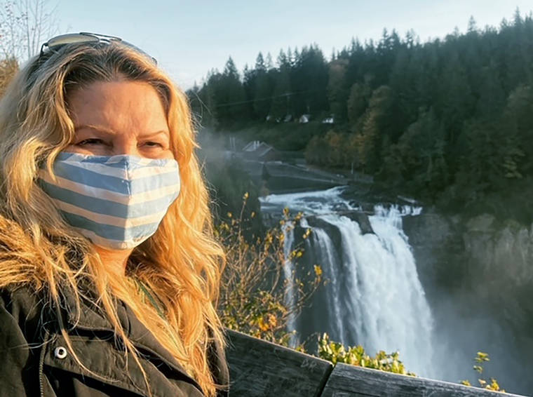 ZANA COOPER VIA AP
                                In this photo provided by Zana Cooper, Cooper of Murrieta, Calif., poses for a selfie at Snoqualmie Falls in Wash., on Oct. 25. Cooper tested positive for COVID-19 after attending a Thanksgiving dinner with her son’s girlfriend’s family. At the dinner, the girlfriend’s father, who had recently traveled to Florida, said he wasn’t feeling well and went to bed early. Cooper learned the following Sunday that he tested positive.