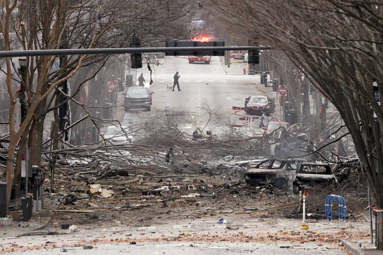 ASSOCIATED PRESS
                                Emergency personnel work near the scene of an explosion in downtown Nashville, Tenn. Buildings shook in the immediate area and beyond after a loud boom was heard early Christmas morning.