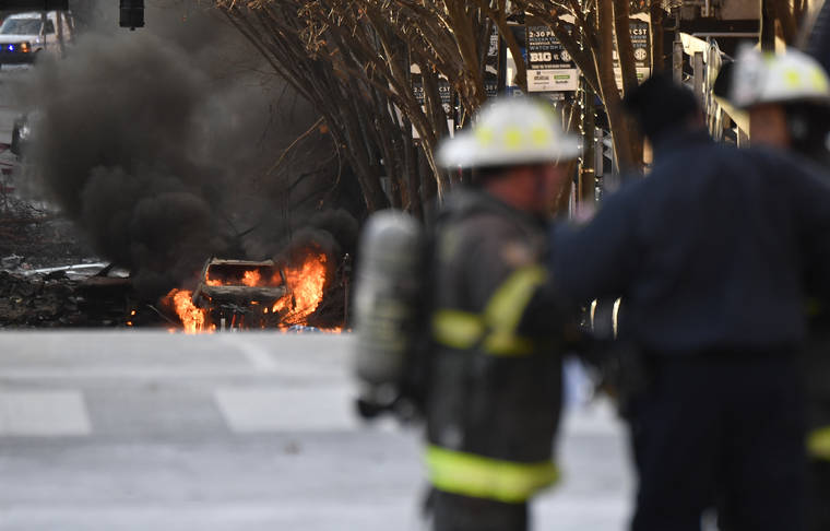 ASSOCIATED PRESS
                                A vehicle is on fire after an explosion in the area of Second and Commerce in Nashville, Tenn. Buildings shook in the immediate area and beyond after a loud boom was heard early Christmas morning.