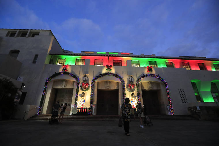 JAMM AQUINO / DEC. 9 Honolulu Hale in downtown Honolulu is lit up for the holidays. The City and County of Honolulu has extended the use of its $500 “City Card” for disadvantaged families by two days to Tuesday at 11:59 p.m.