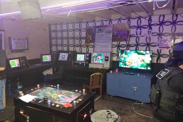 COURTESY HONOLULU POLICE DEPARTMENT
                                Honolulu police seized more than dozen gambling machines during a raid at two illegal game rooms in Kakaako Wednesday night.