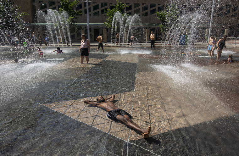 JASON FRANSON/THE CANADIAN PRESS VIA ASSOCIATED PRESS
                                Kais Bothe relaxed in the cool in the city hall pool, as temperatures hit 98 degrees Fahrenheit in Edmonton, Alberta, today.