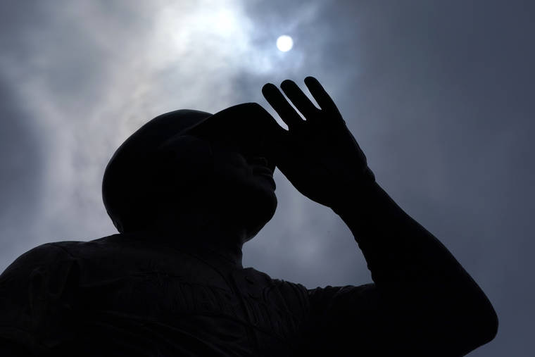 ASSOCIATED PRESS
                                The sun was seen through moving clouds, today, above the statue of Seattle Mariners Hall-of-Famer Ken Griffey Jr. at T-Mobile Park in Seattle. Temperatures cooled considerably in western Washington, Oregon and British Columbia today after several days of record-breaking heat, but the interior regions of the region were still sweating through triple-digit temperatures as the weather system moved east.