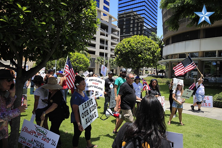 Protesters gather in downtown Honolulu to rally for full reopening of ...