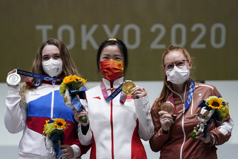 ASSOCIATED PRESS
                                Silver medalist Anastasiia Galashina, left, of the Russian Olympic Committee, gold medalist Yang Qian, of China, center, and bronze medalist Nina Christen, of Switzerland stand after the women’s 10-meter air rifle at the Asaka Shooting Range.