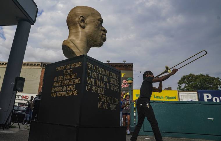 George Floyd statue cleaned and moved after vandalism in New York City ...