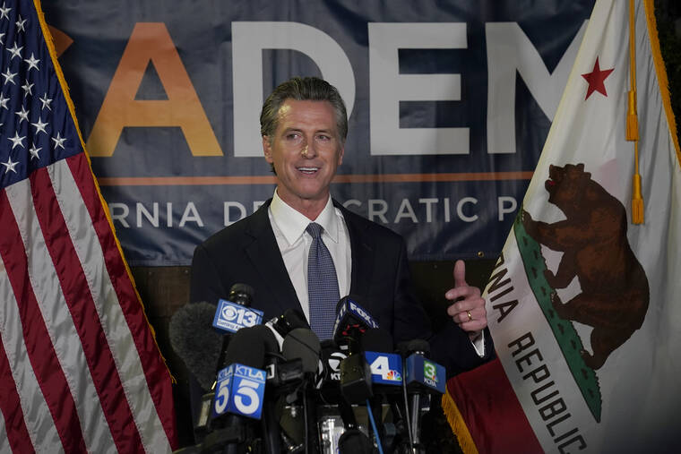 ASSOCIATED PRESS
                                California Gov. Gavin Newsom addresses reporters, after beating back the recall attempt that aimed to remove him from office, at the John L. Burton California Democratic Party headquarters in Sacramento, Calif., tonight.