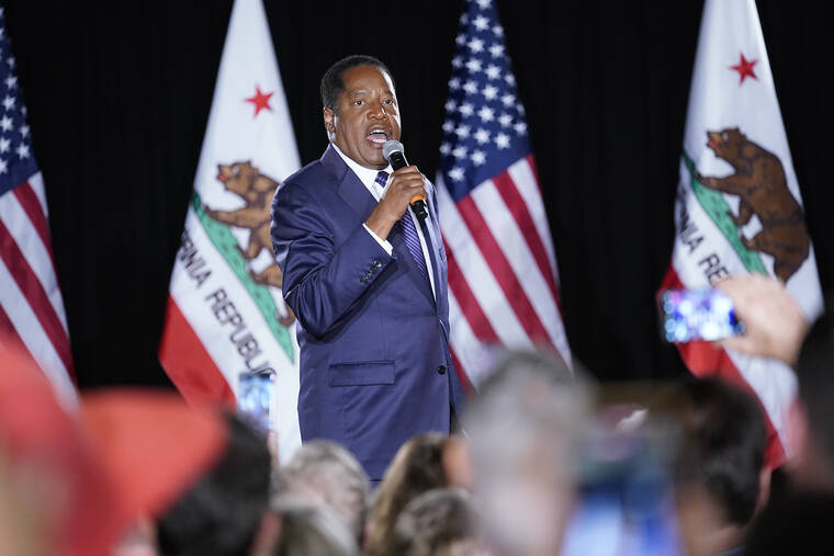 ASSOCIATED PRESS
                                Republican conservative radio show host Larry Elder speaks after losing the California gubernatorial recall election today in Costa Mesa, Calif.