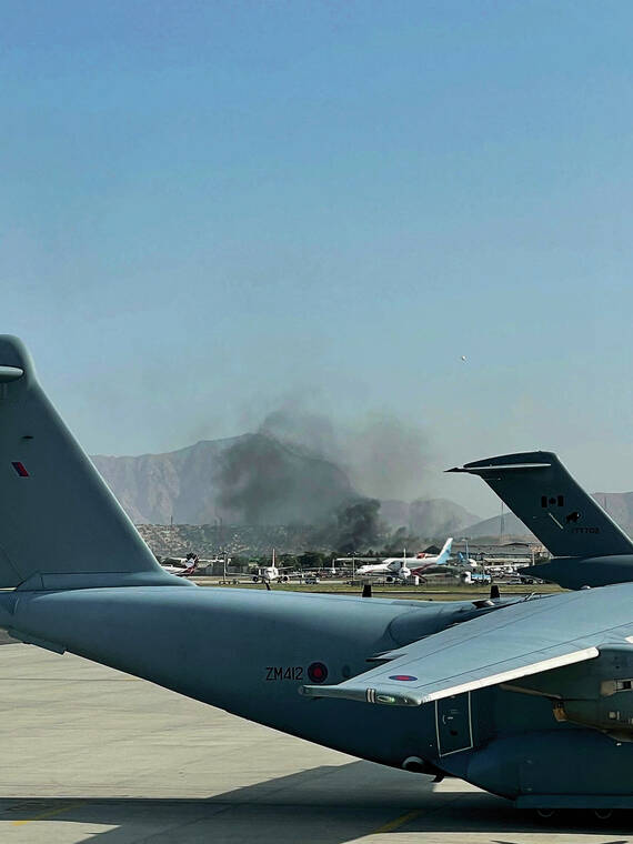 COURTESY COLLIN CHOW HOY
                                On Aug. 15, when 1st Lt. Collin Chow Hoy flew the cargo aircraft into Kabul airport, smoke was visible as the Taliban took the capital.