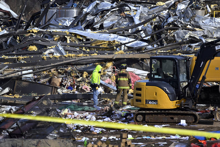 ASSOCIATED PRESS
                                Emergency response workers digged through the rubble of the Mayfield Consumer Products candle factory in Mayfield, Ky., Saturday. An employee of the Kentucky candle factory where eight workers were killed by a tornado said today that a supervisor threatened her with written disciplinary action if she went home early because storms were approaching.