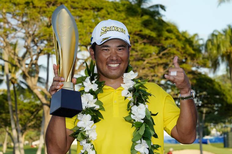ASSOCIATED PRESS Hideki Matsuyama, of Japan, holds the champions trophy after the final round of the Sony Open golf tournament, today, at Waialae Country Club.