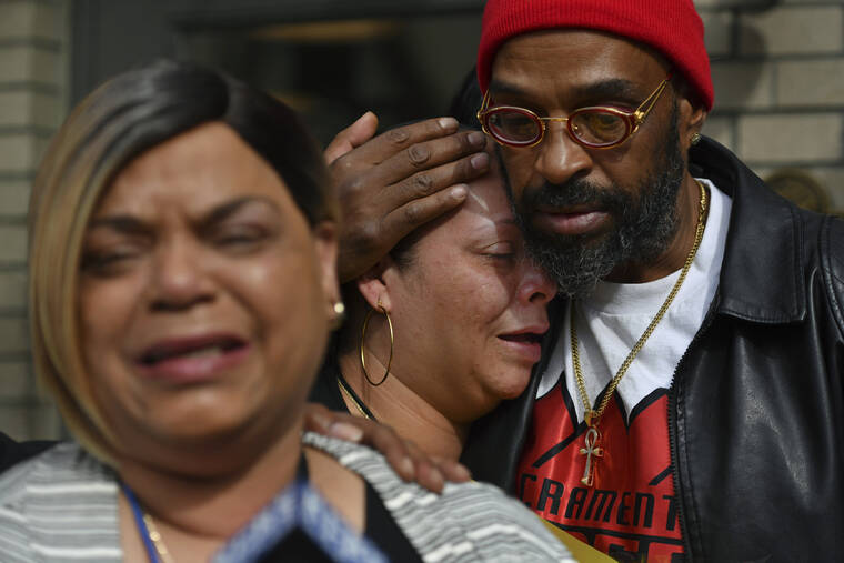 JOSE CARLOS FAJARDO/BAY AREA NEWS GROUP VIA AP
                                Antoinette Walker cries on the shoulder of Frank Turner as Penelope Scott speaks to the media during an interview at the corner of 10th and K street in Sacramento, Calif., on Monday, April 4. Walker is the older sister of De’vazia Turner, who was shot and killed during a mass shooting a day earlier. Frank Turner and Penelope Scott are the mother and father of De’vazia Turner. Multiple people were killed and injured in the shooting.