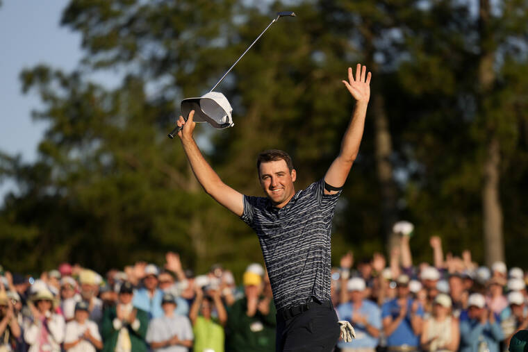 ASSOCIATED PRESS
                                Scottie Scheffler celebrates after winning the 86th Masters golf tournament today in Augusta, Ga.