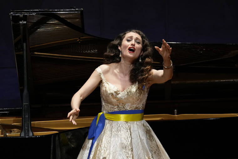 ASSOCIATED PRESS / APRIL 14
                                Oksana Stepanyuk, a Ukrainian soprano opera singer living in a Tokyo suburb, sings during a charity concert in Kokubunji, west of Tokyo.