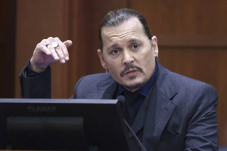 ASSOCIATED PRESS
                                Actor Johnny Depp testifies in the courtroom at the Fairfax County Circuit Court in Fairfax, Va., today. Actor Johnny Depp sued his ex-wife Amber Heard for libel in Fairfax County Circuit Court after she wrote an op-ed piece in the Washington Post in 2018 referring to herself as a “public figure representing domestic abuse.”