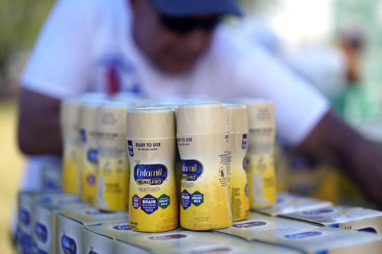 ASSOCIATED PRESS
                                Infant formula is stacked on a table during a baby formula drive to help with the shortage Saturday in Houston.