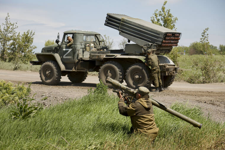 ASSOCIATED PRESS / MAY 28
                                A Donetsk People’s Republic militia serviceman gets ready to fire with a man-portable air-defense system at a position not far from Panteleimonivka, in territory under the government of the Donetsk People’s Republic, eastern Ukraine.