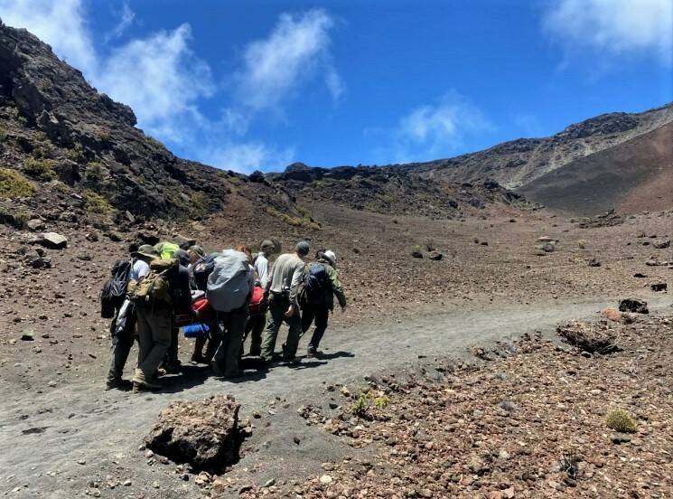 COURTESY NATIONAL PARK SERVICE Rangers carried a man from the Kapalaoa Cabin to the Haleakala.