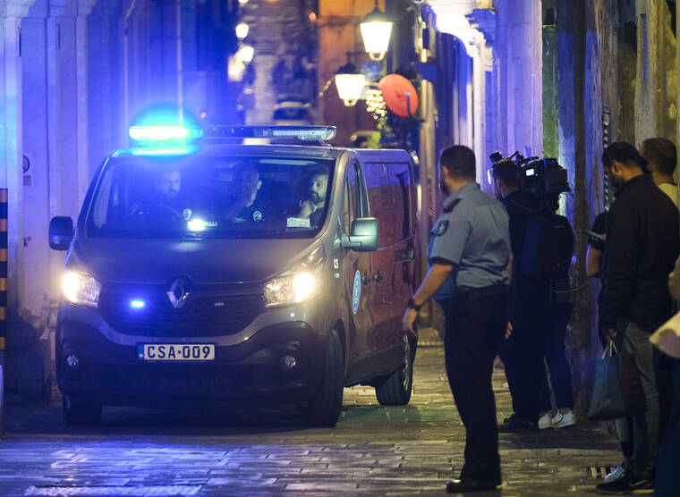 ASSOCIATED PRESS
                                The van carrying brothers George and Alfred Degiorgio, not visible and accused of killing journalist Daphne Caruana Galizia, leaves the Valletta Law court, today. In a stunning reversal, the two brothers who are on trial for the car-bomb murder of the Maltese anti-corruption journalist entered guilty pleas on the first day of trial.