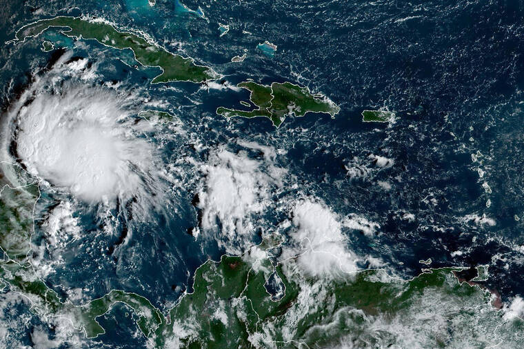 Hurricane Lisa Makes Landfall In Belize, Weakens To Tropical Storm ...