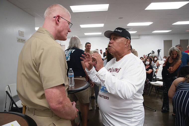 GEORGE F. LEE / GLEE@STARADVERTISER.COM
                                U.S. Navy Vice Adm. John Wade, left, listened to Robert Whitford at the public meeting.