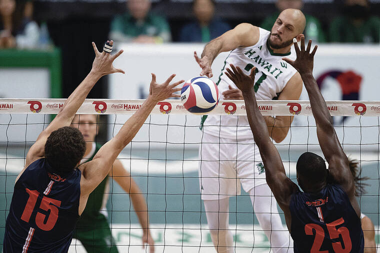 GEORGE F. LEE / GLEE@STARADVERTISER.COM 
                                Hawaii middle Guilherme Voss pounded down a kill between Pepperdine’s Joe Deluzio and Akin Akinwumi on Wednesday.