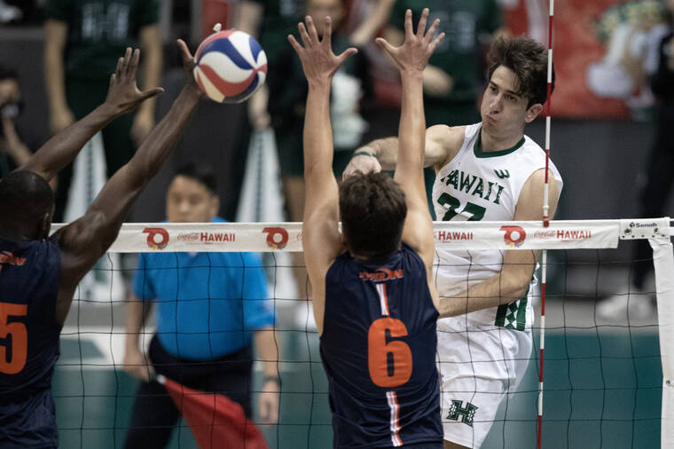 GEORGE F. LEE / GLEE@STARADVERTISER.COM 
                                Hawaii’s Spyros Chakas spiked between two Pepperdine blockers in Wednesday’s match at SimpliFi Arena at Stan Sheriff Center.