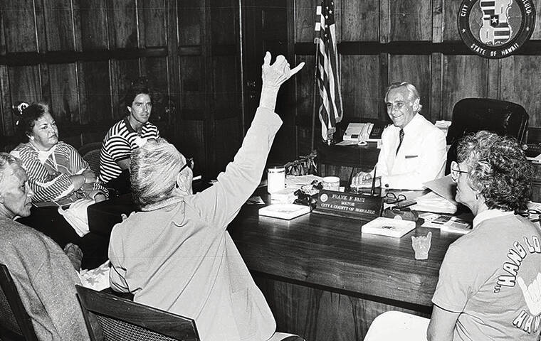 STAR-ADVERTISER
                                Kehau Kawahigashi threw a shaka in a January 1969 meeting with Frank Fasi and Laie community leaders.