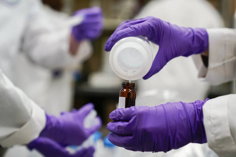 ASSOCIATED PRESS
                                Eva Stebel, water researcher, pours a water sample into a smaller glass container for experimentation as part of drinking water and PFAS research at the U.S. Environmental Protection Agency Center For Environmental Solutions and Emergency Response, Feb. 16, in Cincinnati.