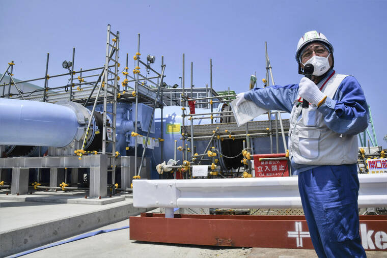 KYODO NEWS VIA AP / JUNE 26
                                An employee of Tokyo Electric Power Company explains about the facility to be used to release treated radioactive water to media at Fukushima Daiichi nuclear power plant in Fukushima, northern Japan, Monday, June 26. All equipment needed for the release into the sea of treated radioactive wastewater from the wrecked Fukushima nuclear plant has been completed and will be ready for a safety inspection by Japanese regulators this week, the plant operator said Monday, as opposition to the plan continues in and outside Japan over safety concerns.