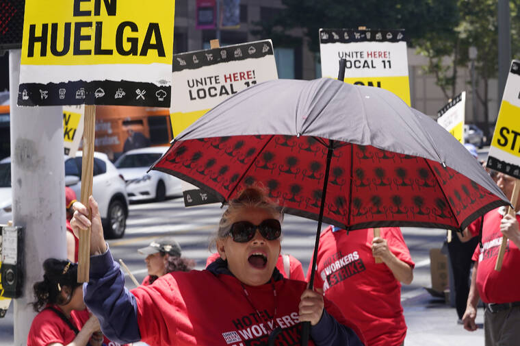 ASSOCIATED PRESS
                                Striking hotel workers rally outside the InterContinental Los Angeles Downtown Hotel, Tuesday, in downtown Los Angeles.