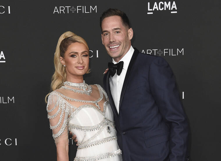 INVISION / AP
                                Paris Hilton, left, and Carter Reum appear at the LACMA Art + Film Gala in Los Angeles on Nov. 6, 2021. The couple was photographed over the weekend on a Maui beach.