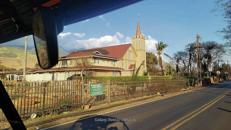 COURTESY JAMES ORTIZ
                                Maria Lanakila Catholic Church was still standing after Tuesday’s fire. Scorched trees can be seen beyond the church.