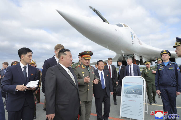 KOREAN CENTRAL NEWS AGENCY/KOREA NEWS SERVICE VIA AP
                                In this photo provided by the North Korean government, North Korean leader Kim Jong Un, front center, with Russian Defense Minister Sergei Shoigu, center right, visits an airport to see military planes near the port city of Vladivostok in the Russian Far East. Independent journalists were not given access to cover the event depicted in this image distributed by the North Korean government. The content of this image is as provided and cannot be independently verified. The Korean language watermark on the image as provided by the source reads: “KCNA” which is the abbreviation for Korean Central News Agency.