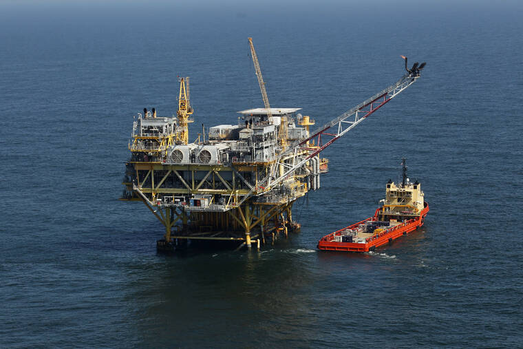 ASSOCIATED PRESS / 2011
                                A rig and supply vessel are viewed in the Gulf of Mexico off the cost of Louisiana, April 10, 2011. Democratic and Republican leaders of the U.S. Senate’s energy committee want President Joe Biden’s administration to forge ahead with a sale of Gulf of Mexico oil and gas leases on Nov. 8, even though it’s no longer under a court order to do so.