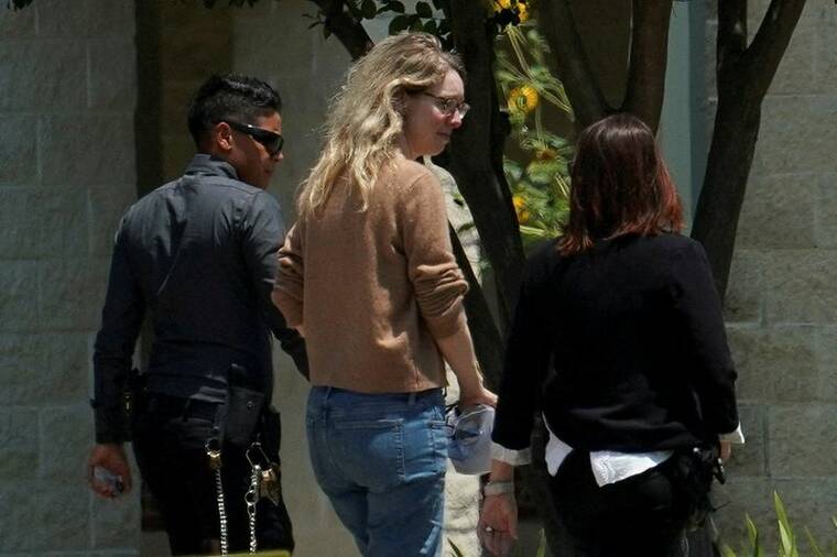 REUTERS/GO NAKAMURA
                                Theranos founder Elizabeth Holmes arrives to begin serving her prison sentence for defrauding investors in the failed blood-testing startup, at the Federal Prison Camp in Bryan, Texas.