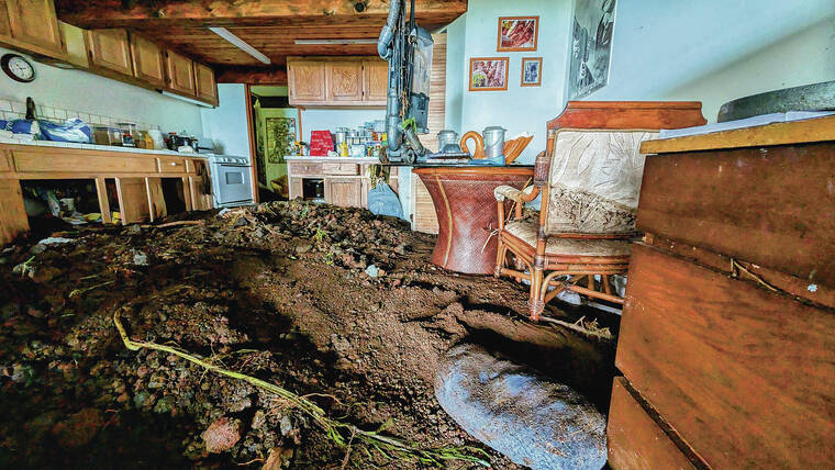 COURTESY BOB MARTIN / GOFUNDME
                                Mud and debris left by Tropical Storm Hone are piled high in the living quarters of the former “Hobbit House” bed-and-breakfast in Waiohinu, Hawaii, home of Sherry Mastandrea and her beekeeper son, Jacob Satterwhite.