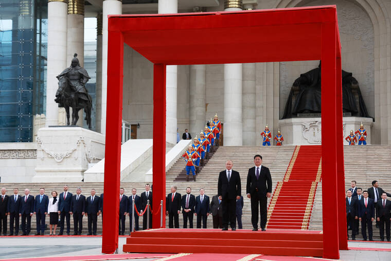 SPUTNIK/KRISTINA KORMILITSYNA/KREMLIN VIA REUTERS
                                Russian President Vladimir Putin and Mongolian President Ukhnaagiin Khurelsukh attend an official welcoming ceremony in Ulaanbaatar, Mongolia.