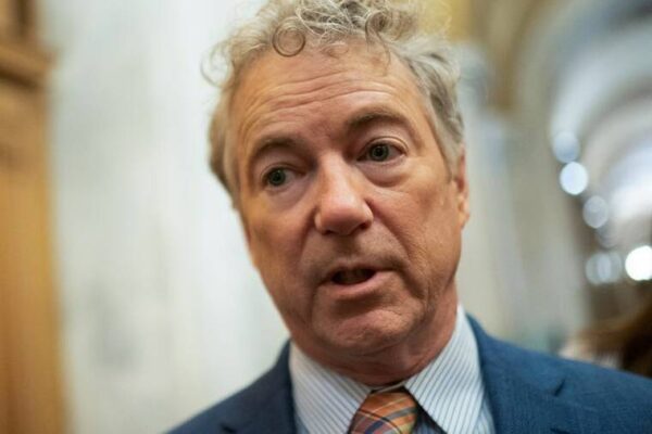 REUTERS/NATHAN HOWARD
                                Sen. Rand Paul (R-KY) speaks with members of the media ahead of a Senate vote to begin work on a bill that includes aid for Ukraine, Israel and Taiwan in Washington.