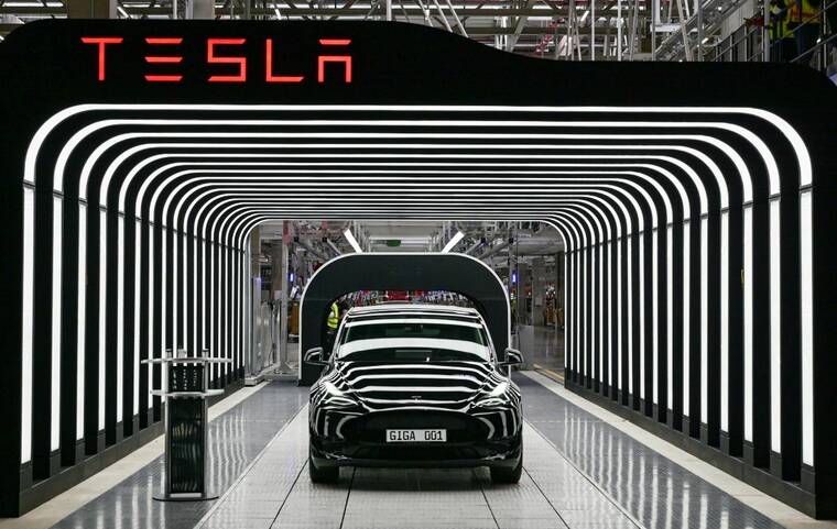 Tesla hits $1 trillion market value